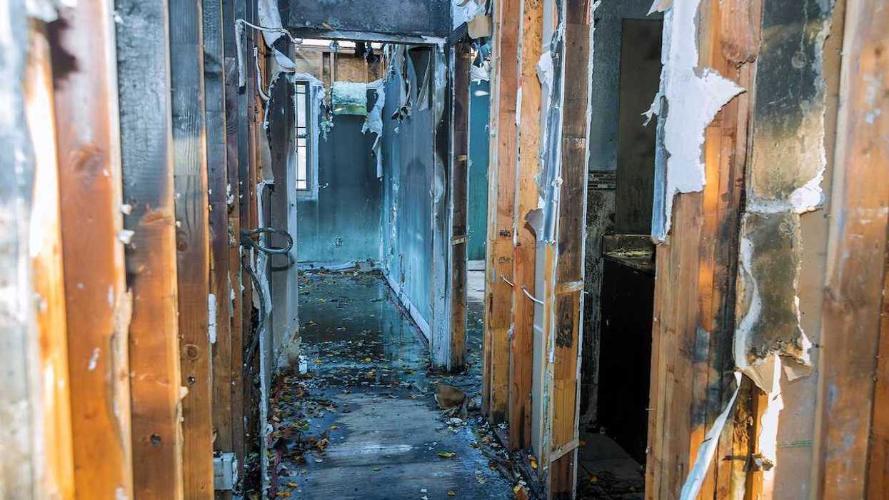 Completely burnt wooden house consequences of fire in California USA