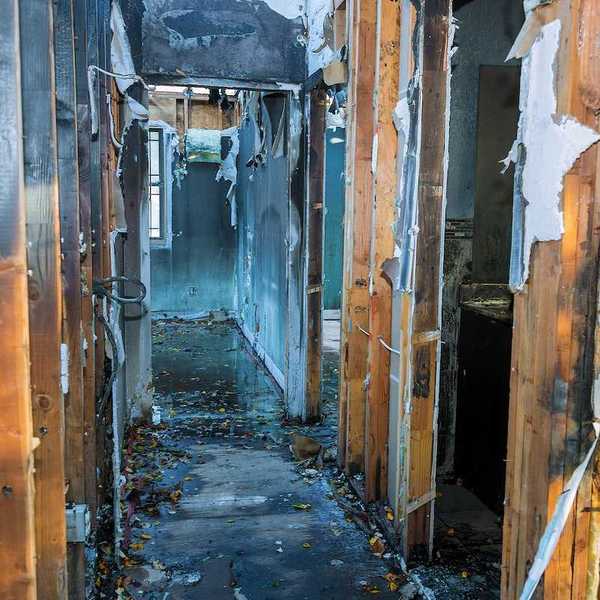 Completely burnt wooden house consequences of fire in California USA