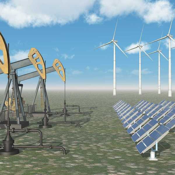 Computer generated 3D illustration with oil pumps, solar panels and wind turbines