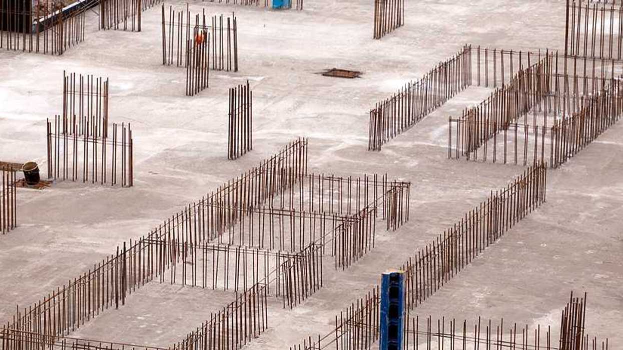 Construction of the foundation of a building with concrete and metal rebar