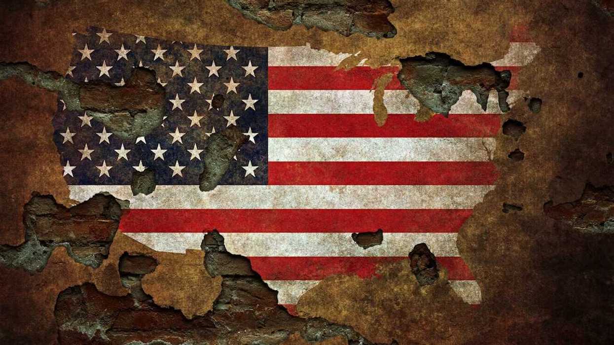 Cracked, faded, pockmarked, US flag motif in the shape of the US