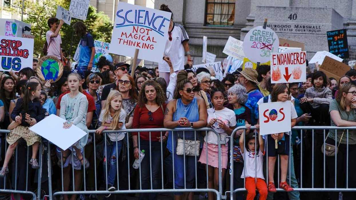 Crowd of mostly children and adults demonstrate displeasure over anti-science, anti-climate, policies.