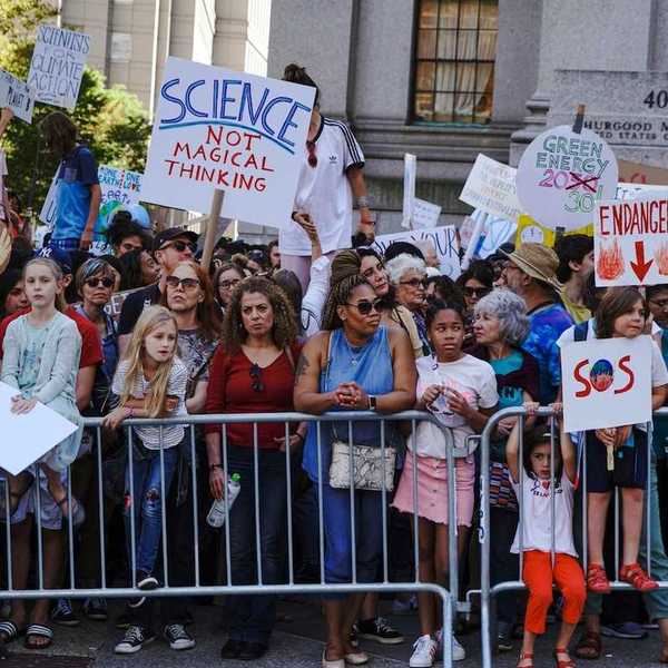 Crowd of mostly children and adults demonstrate displeasure over anti-science, anti-climate, policies.