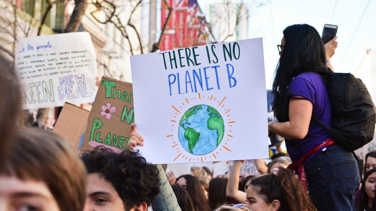Crowd of young people marching for the planet