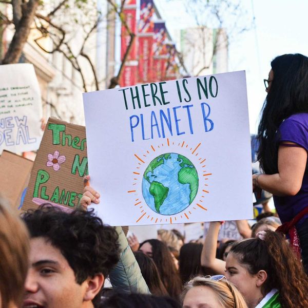 Crowd of young people marching for the planet