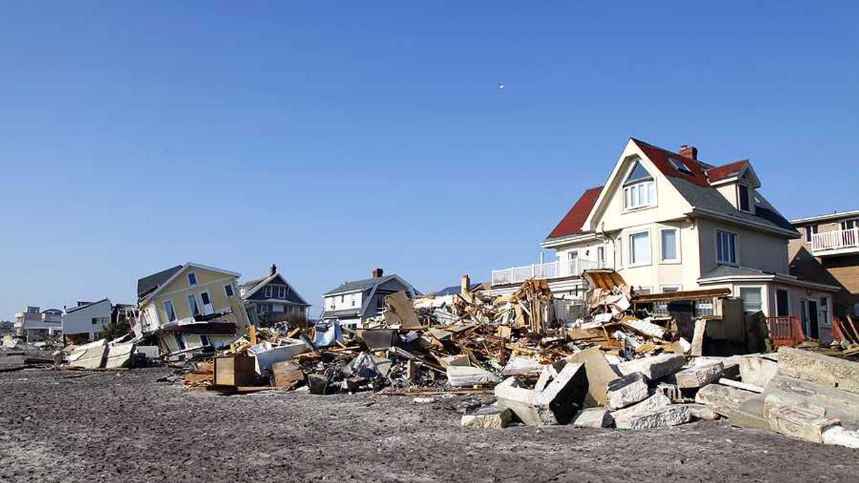 Damaged houses along a beach