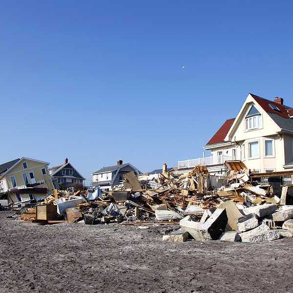 Damaged houses along a beach