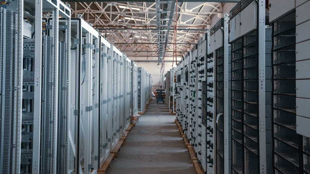Data Center corridor lined with racks and racks of electronics