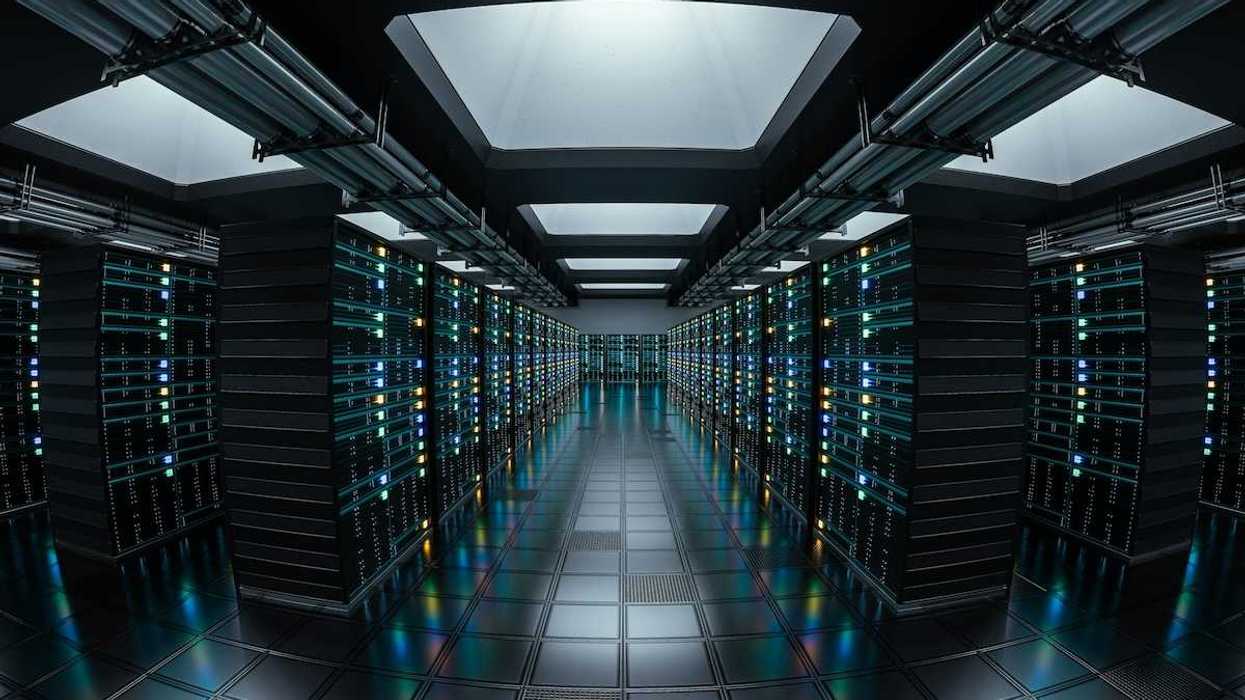 Data repository depicted by a long corridor lined with racks of tech