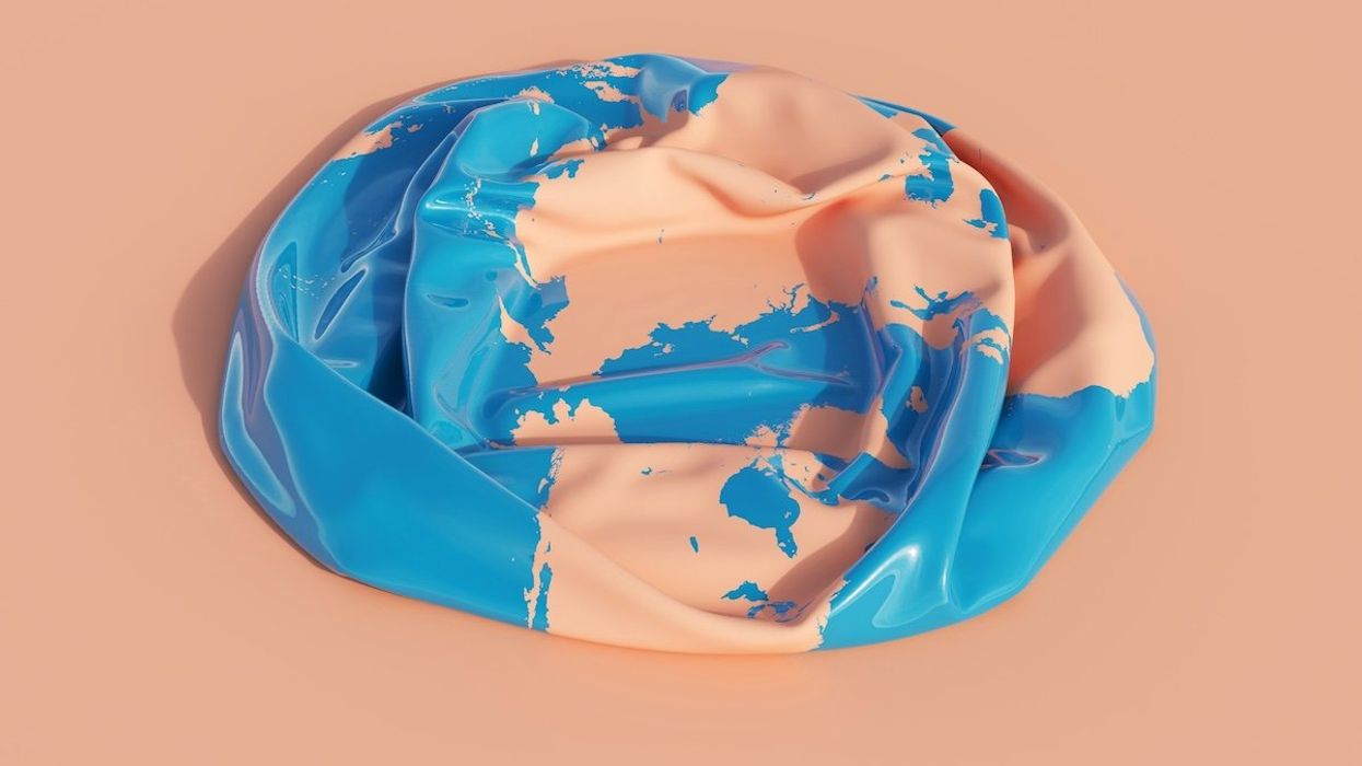 Deflated "earth" plastic beachball .