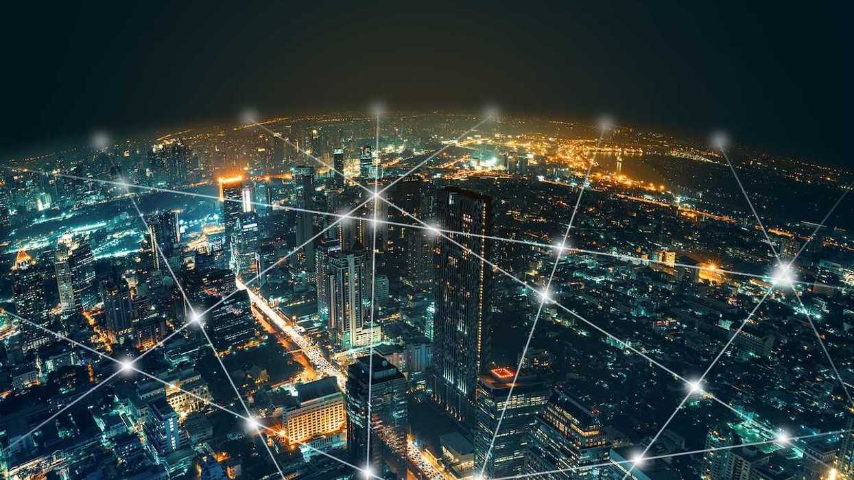 Depiction of network and connection technology on a night city background at business center bangkok thailand.