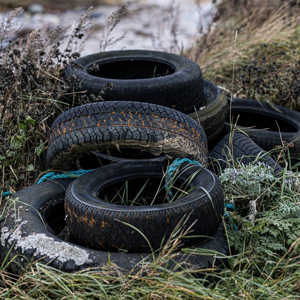 Discarded tires in a field