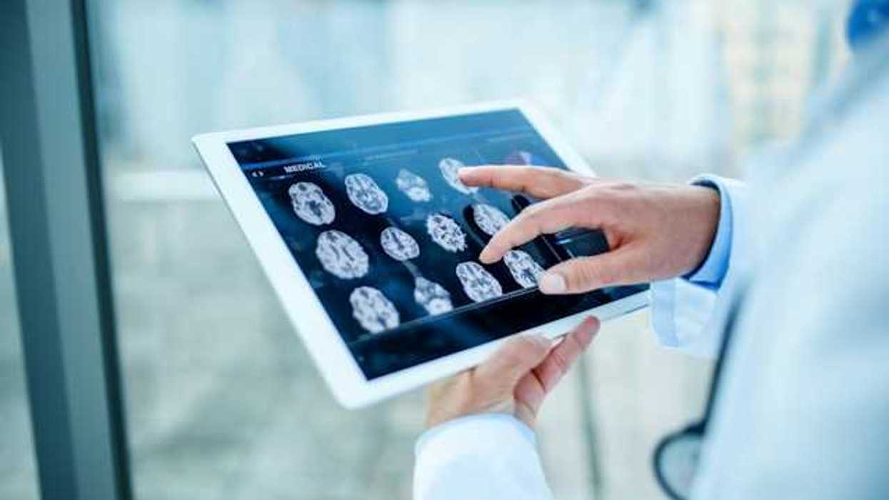 Doctor looking at xrays on a tablet