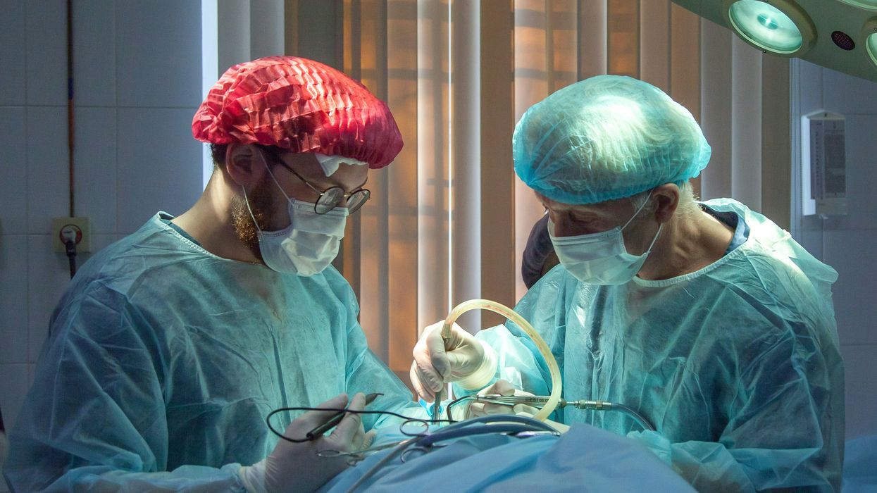 Doctors perform surgery