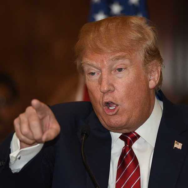 Donald Trump pointing finger and gesturing in a threatening manner