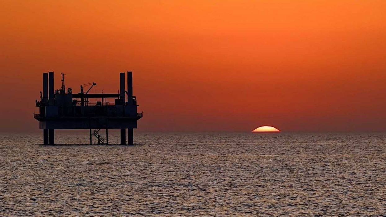 drilling platform against colorful sunset