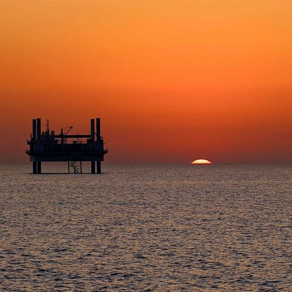 drilling platform against colorful sunset