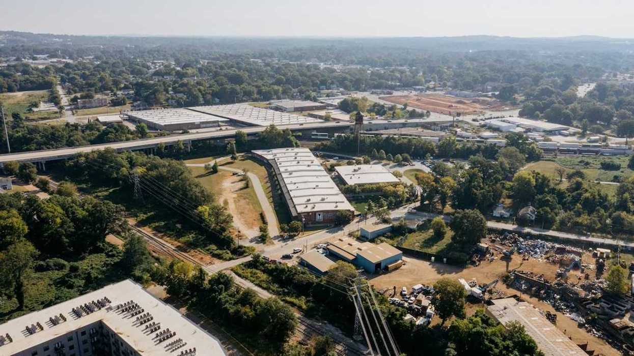 Drone shot of industrial buildings in a rural/urban area