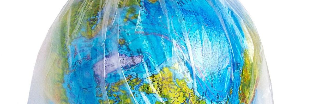 Earth depicted as a globe encased in a plastic bag.