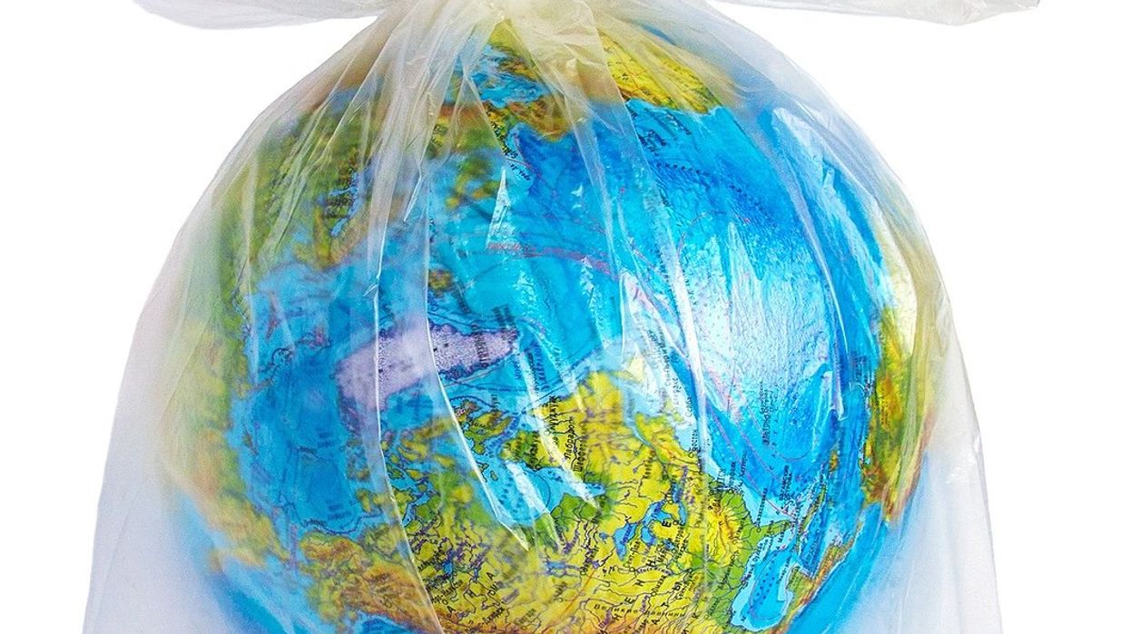 Earth depicted as a globe encased in a plastic bag.