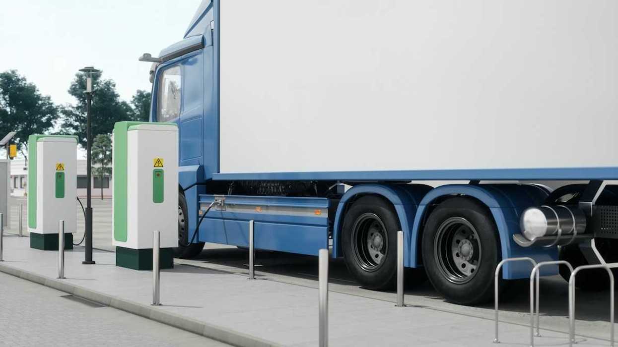 Electric semi-truck filling up at a charging station