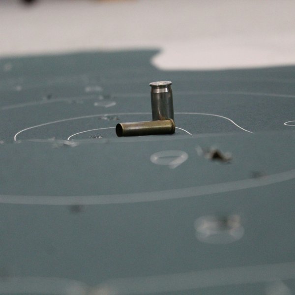 empty bullet shells sitting on a target