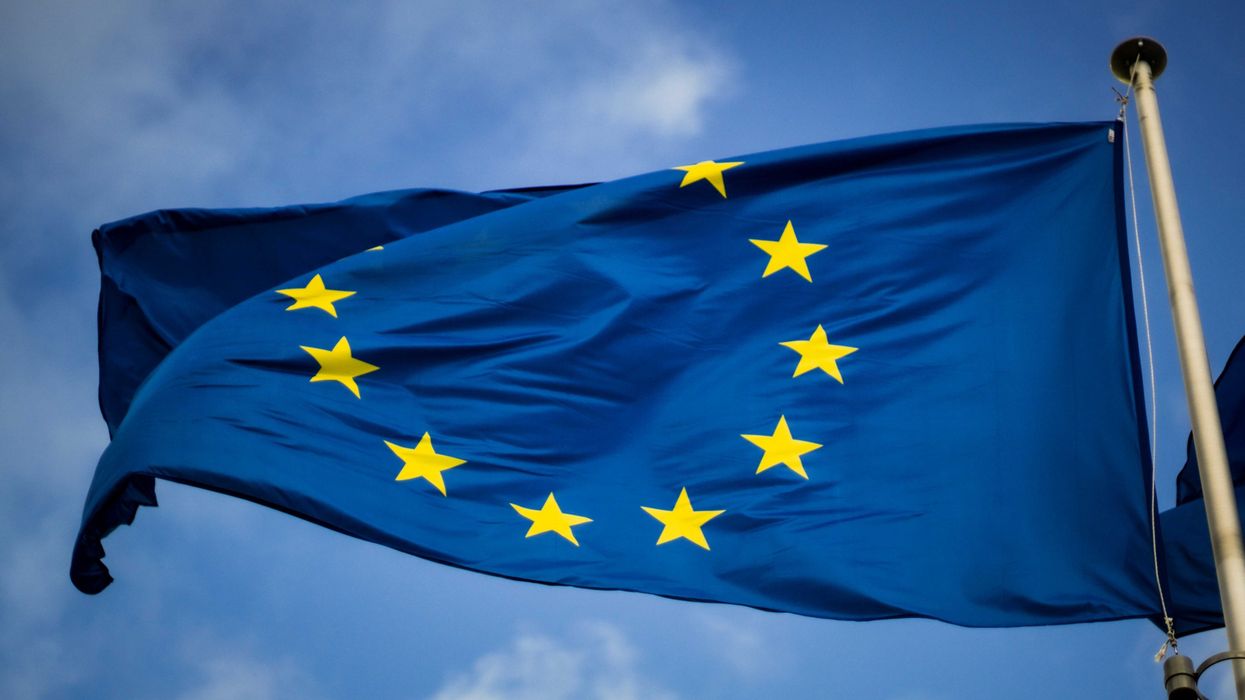 European union flag blue with yellow stars in a circle.