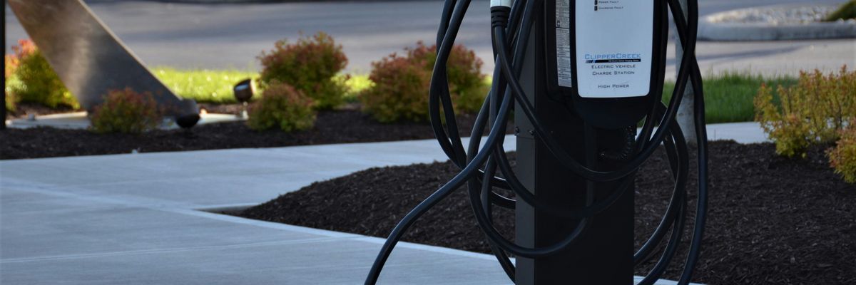 EV charger on sidewalk.