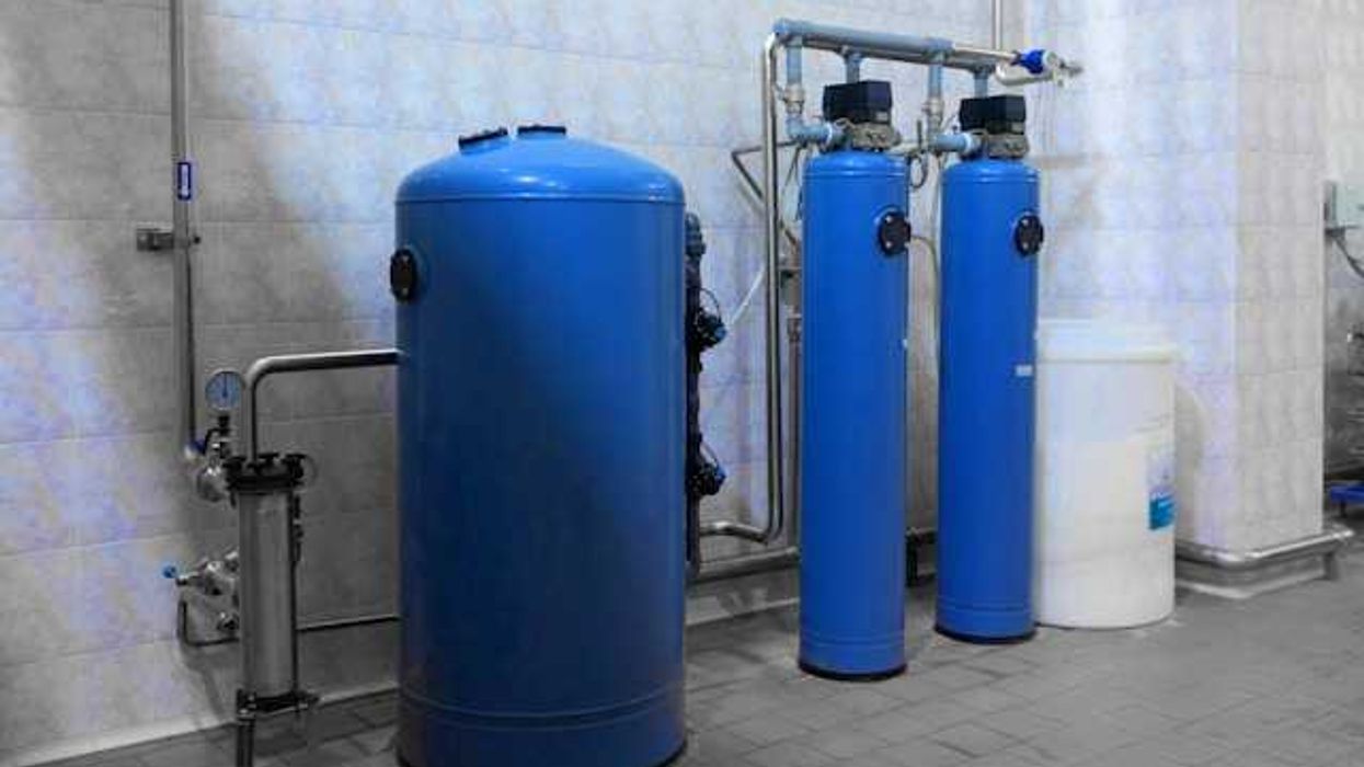 Filtration system with blue tubes and silver pipes