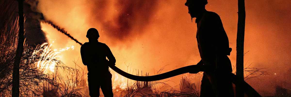 Firefighters fight a blaze