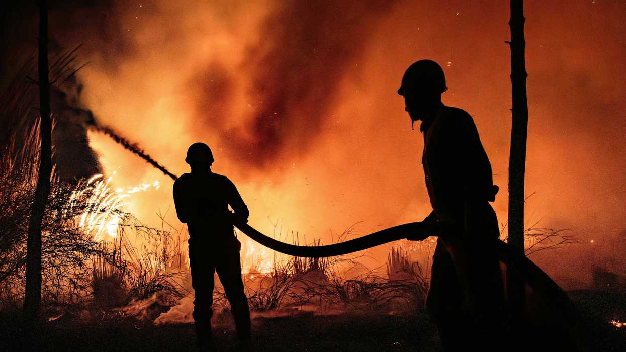 Firefighters fight a blaze