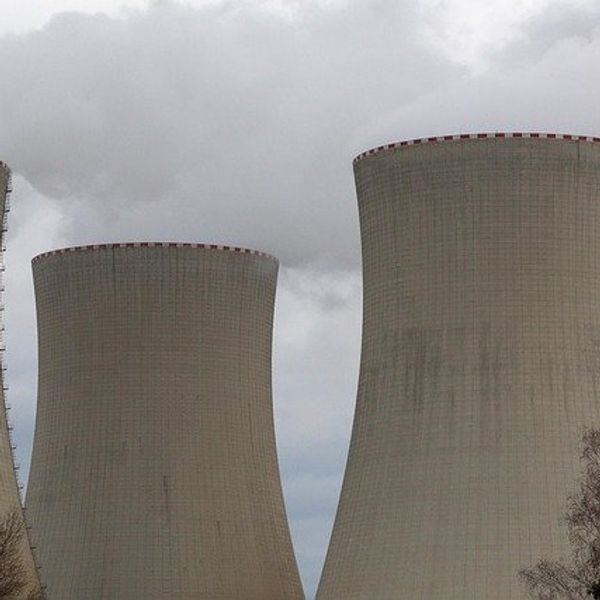 Four towers in a nuclear energy plant.