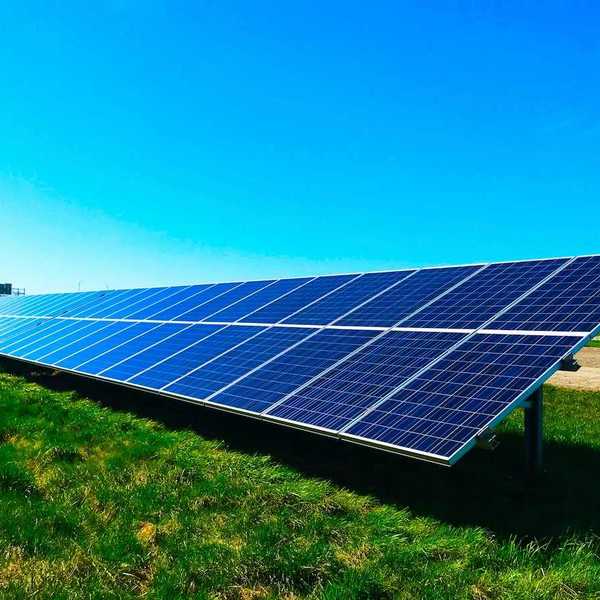 Free standing solar panels on green grass