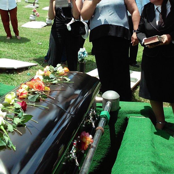 funeral coffin mourners