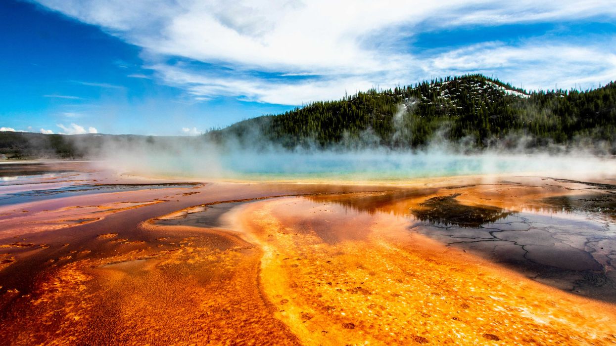 geyser within mountain range during daytime