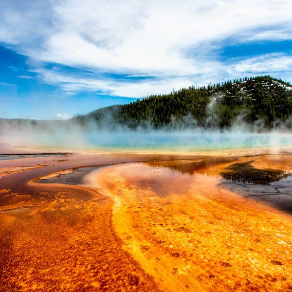 geyser within mountain range during daytime