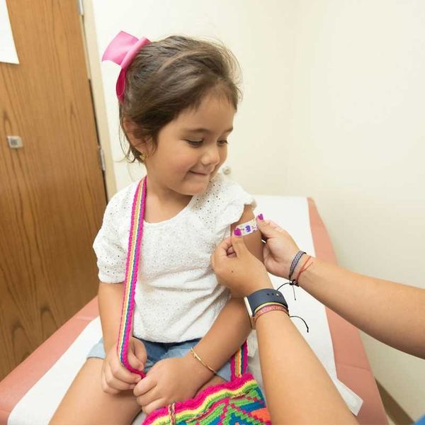 girl being vaccinated