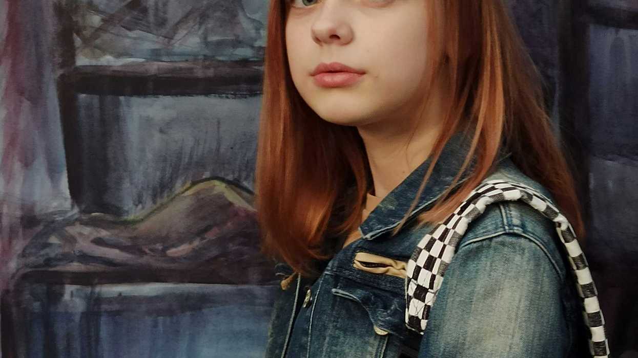 girl in blue denim jacket.