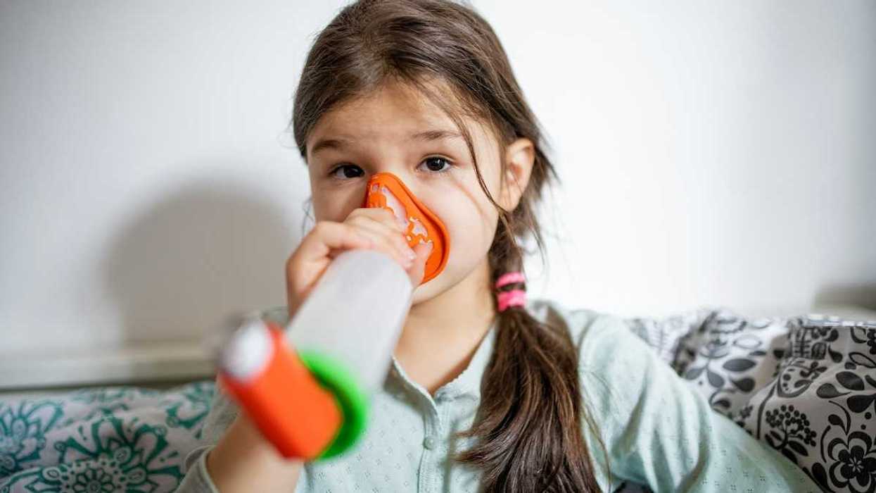 Girl using an inhaler