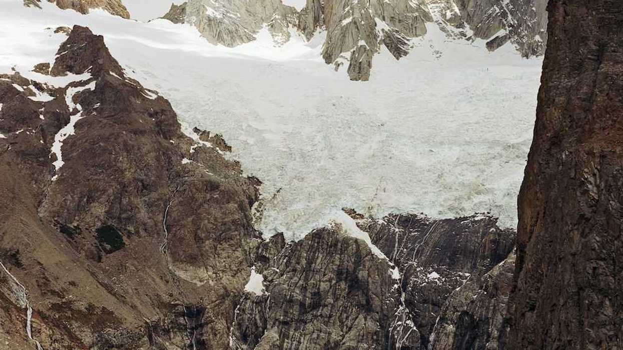 Glaciers hanging over an alpine lake formed by glacial meltwater