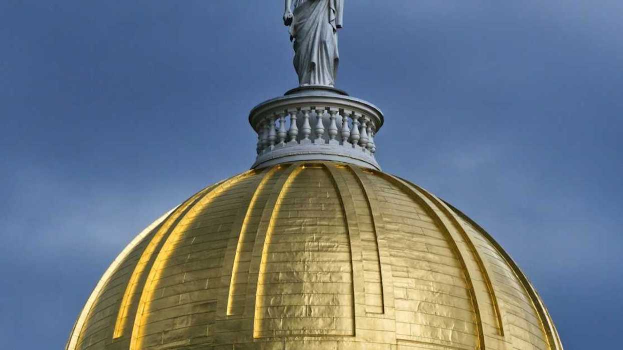 Golden dome of Vermont statehouse, Montpelier, Vermont, topped by a statue named Agriculture, a representation of Ceres, an ancient Roman goddess of agriculture.