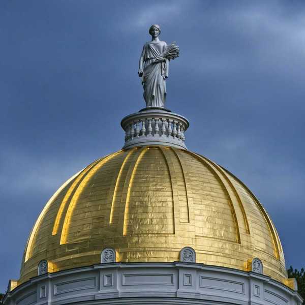 Golden dome of Vermont statehouse, Montpelier, Vermont, topped by a statue named Agriculture, a representation of Ceres, an ancient Roman goddess of agriculture.