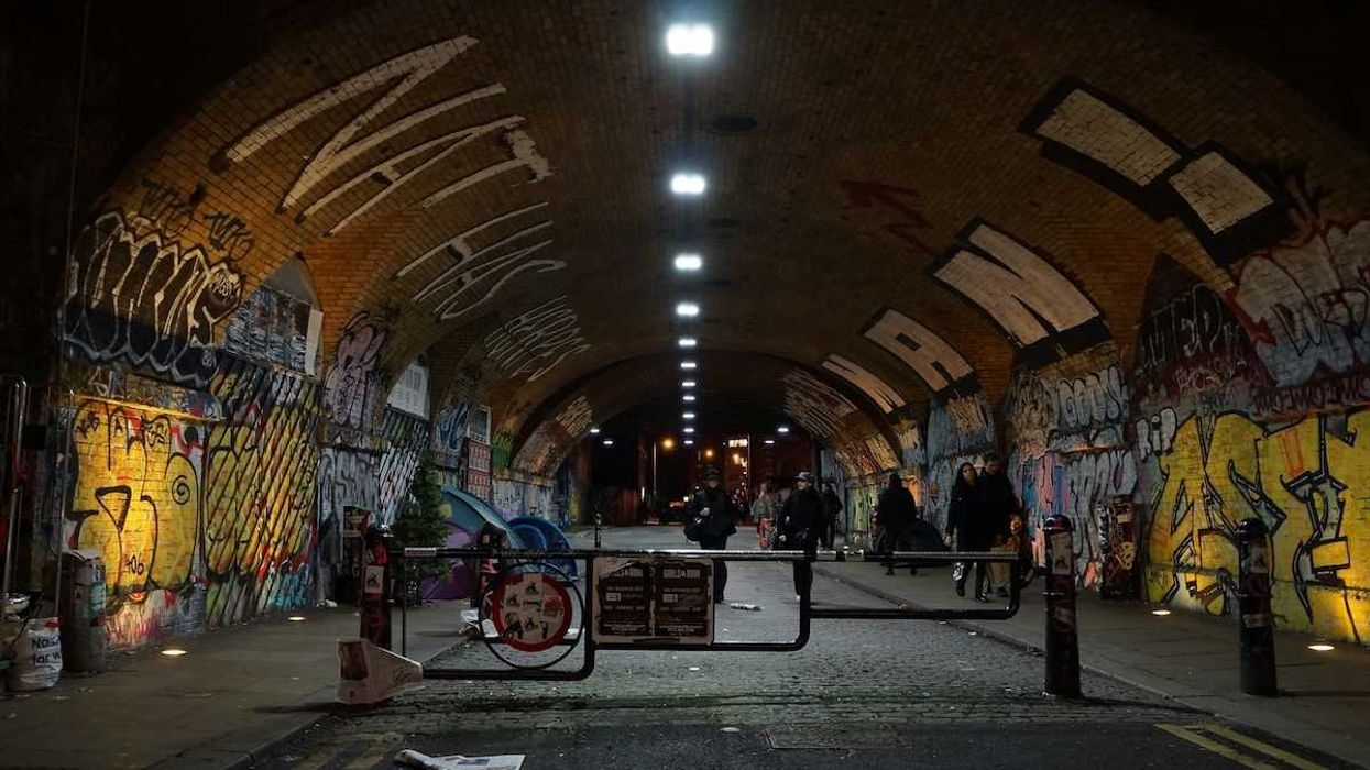 graffiti-filled tunnel in nighttime London