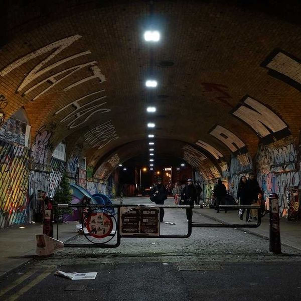 graffiti-filled tunnel in nighttime London