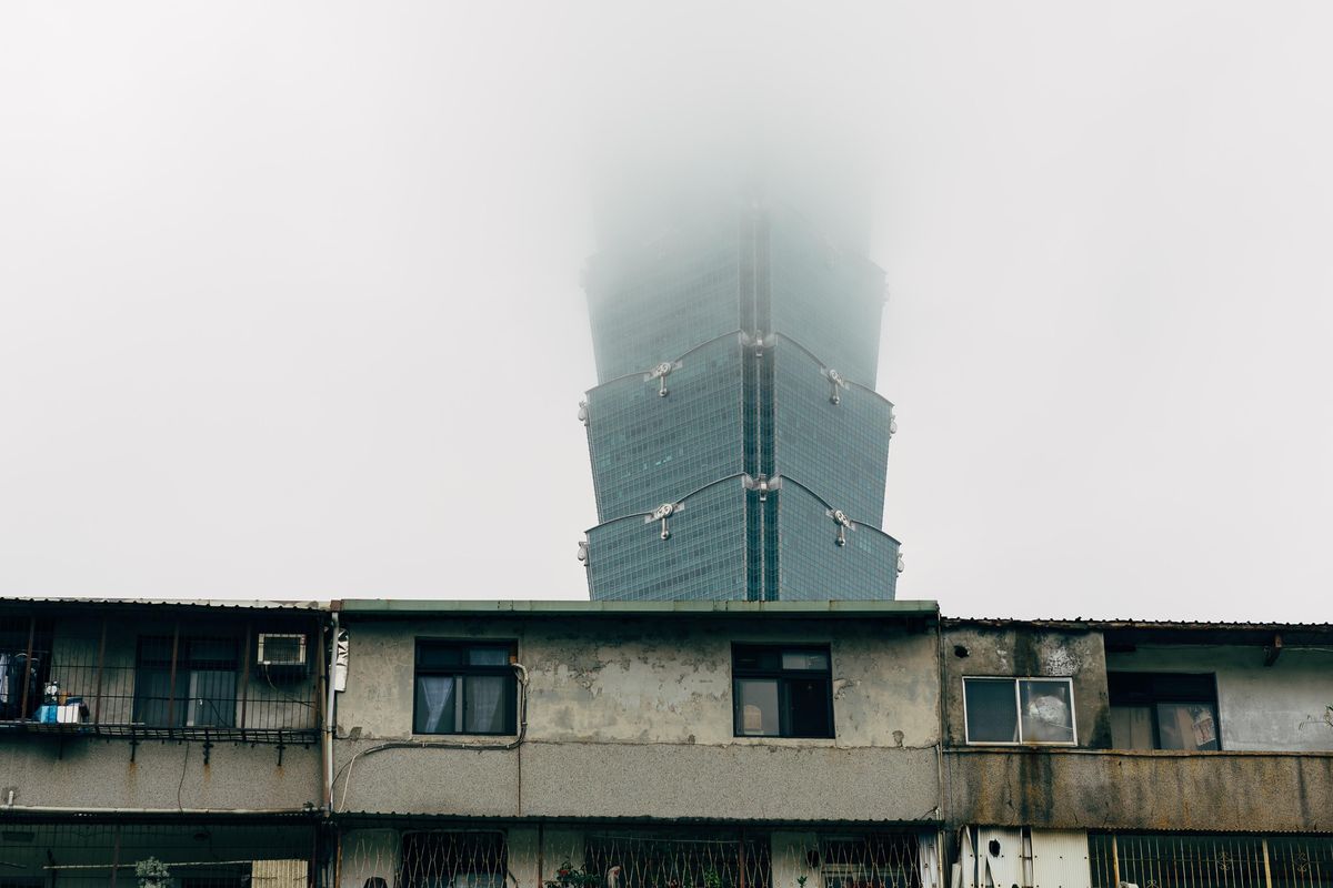 gray concrete building under white sky during daytime