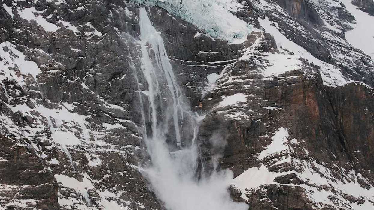 Hanging glacier with meltwater and snow sloughing from the tongue