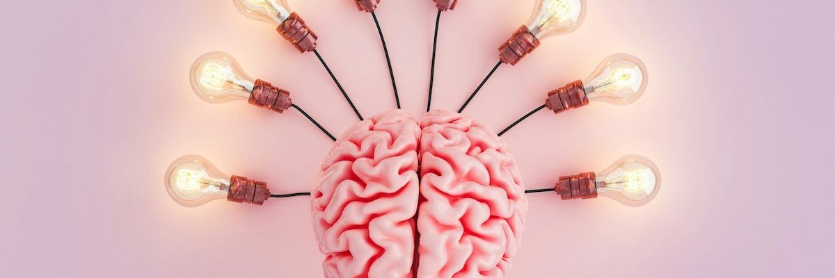 Human brain depicted connected to eight lightbulbs.