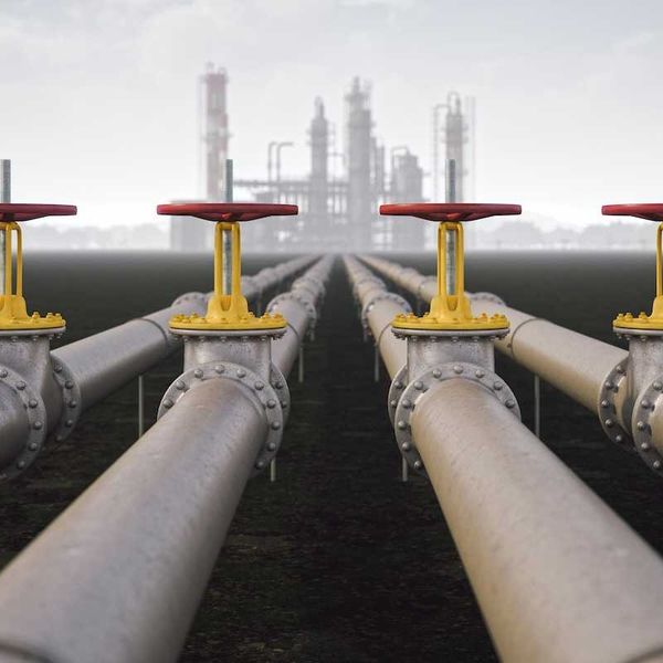 Illustration depicting a 4-way pipeline leading to a distant refinery