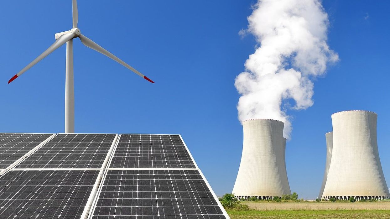 Image of Wind turbines, solar panels, and fossil fuel power plants.
