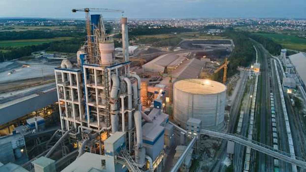 Industrial plant with silos next to a city